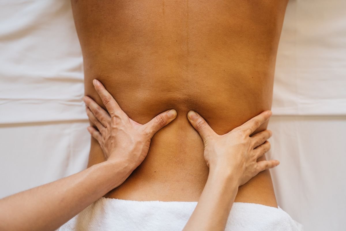 Close-up of a therapist's hands during a back massage at Ganga Spa